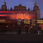 
              Climate activists hold up illuminated placards with climate messages outside the Kelvingrove Art Gallery and Museum as the COP26 U.N. Climate Summit takes place in Glasgow, Scotland, Wednesday, Nov. 3, 2021. (AP Photo/Alastair Grant)
            