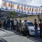 
              Voters up outside a polling station during general elections in Tegucigalpa, Honduras, Sunday, Nov. 28, 2021. (AP Photo/Moises Castillo)
            