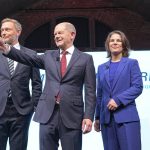 
              From left, Christian Lindner, party leader of the FDP, Olaf Scholz, SPD candidate for chancellor and executive federal minister of finance, Annalena Baerbock, federal leader of the Green party and Robert Habeck, federal leader of the Green party at a joint news conference in Berlin, Germany, Wednesday, Nov. 24, 2021. After weeks of negotiations the leaders of the three parties present a coalition contract for a new German government. (Kay Nietfeld/dpa via AP)
            