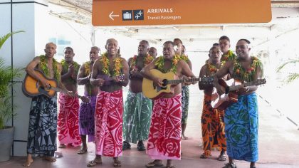 In this photo released by Tourism Fiji, guests receive a traditional Fijian welcome as they arrive ...
