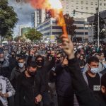 
              Protesters march during a strike organized by metal workers in Cadiz, southern Spain, Tuesday, Nov. 23, 2021. (AP Photo/Javier Fergo)
            