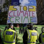 
              Extension Rebellion activists take part in a demonstration against 'Greenwashing' (an attempt to make people believe that your company or government is doing more to protect the environment than it really is) near the COP26 U.N. Climate Summit in Glasgow, Scotland, Wednesday, Nov. 3, 2021. The U.N. climate summit in Glasgow gathers leaders from around the world, in Scotland's biggest city, to lay out their vision for addressing the common challenge of global warming. (AP Photo/Alastair Grant)
            