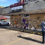 
              A memorial to slain rapper Young Dolph sits in front of the boarded windows at Makeda's Cookies on Thursday, Nov. 18, 2021, in Memphis, Tenn. Police said Young Dolph was fatally shot inside the popular Memphis bakery on Wednesday. (AP Photo/Adrian Sainz)
            