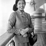 FILE - Entertainer Josephine Baker is seen aboard the French liner Liberte upon her arrival in New York City harbor, on October 3, 1950. France is inducting Josephine Baker - Missouri-born cabaret dancer, French Resistance fighter and civil rights leader - into its Pantheon, the first Black woman honored in the final resting place of France's most revered luminaries. (AP Photo, File)