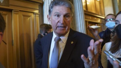 FILE - Sen. Joe Manchin, D-WVa., talks to reporters as he leaves the chamber after a vote, at the C...