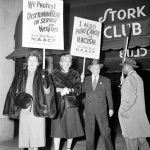 FILE- A protest picket line organized by the New York branch of the National Association for the Advancement of Colored People, parades in front of the Stork Club in New York, Oct. 22, 1951. From left,  Bessie Buchanan, personal secretary to actress Josephine Baker; Laura Hobson, author of "Gentleman's Agreement," and Walter White, executive secretary of the NAACP. The NAACP alleges Miss Baker and party were refused food service at the club on Oct. 16. France is inducting Missouri-born cabaret dancer Josephine Baker, who was also a French World War II spy and civil rights activist - into its Pantheon. She is the first Black woman honored in the final resting place of France's most revered luminaries. On the surface, it's a powerful message against racism, bt by choosing a U.S.-born figure -- entertainer Josephine Baker - critics say France is continuing a long tradition of decrying racism abroad while obscuring it at home. (AP Photo/Marty Lederhandler, File)