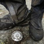 M.J. Eberhart, 83, pauses by a survey marker on the Appalachian Trail, Sunday, Sept. 12, 2021, in Gorham, New Hampshire. Eberhart, who goes by the trail name of Nimblewill Nomad, has hiked all of the country's major long-distance trails. He has also walked the length of Route 66 from Illinois and California. (AP Photo/Robert F. Bukaty)