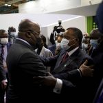 
              Democratic Republic of Congo's President and African Union Chair Felix Tshisekedi, left, and Republic of Congo President Denis Sassou Nguesso, right, embrace and hug after listening to a talk in the pavilion of the Congo Basin at the COP26 U.N. Climate Summit, in Glasgow, Scotland, Wednesday, Nov. 3, 2021. The U.N. climate summit in Glasgow gathers leaders from around the world, in Scotland's biggest city, to lay out their vision for addressing the common challenge of global warming. (AP Photo/Alberto Pezzali)
            