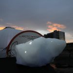 An iceberg delivered by members of Arctic Basecamp is placed on show near the COP26 U.N. Climate Summit in Glasgow, Scotland, Friday, Nov. 5, 2021. The four ton block of ice, originally part of a larger glacier, was brought from Greenland to Glasgow by climate scientists from Arctic Basecamp as a statement to world leaders of the scale of the climate crisis and a visible reminder of what Arctic warming means for the planet. (AP Photo/Alastair Grant)