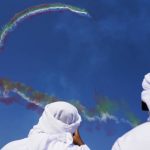 
              Emiratis watch as Al Fursan, the United Arab Emirates Air Force's aerobatic team, performs at the Dubai Air Show in Dubai, United Arab Emirates, Wednesday, Nov. 17, 2021. (AP Photo/Jon Gambrell)
            