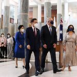 
              South Korean President Moon Jae-in, second left, and his wife, Kim Jung-sook, left, walk with Australian Prime Minister Scott Morrison and his wife, Jenny, right, at Parliament House, in Canberra, Australia, Monday, Dec. 13, 2021. Moon is on a two-day official visit to Australia. (Lukas Coch/Pool Photo via AP)
            