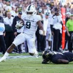 
              FILE - Michigan State running back Kenneth Walker III (9) breaks the tackle of Purdue cornerback Jamari Brown (7) on his way to a touchdown during the first half of an NCAA college football game in West Lafayette, Ind., Nov. 6, 2021. (AP Photo/Michael Conroy, File)
            