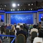 
              Journalists listen to Russian President Vladimir Putin during his annual news conference in Moscow, Russia, Thursday, Dec. 23, 2021. (AP Photo/Alexander Zemlianichenko)
            