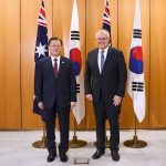
              South Korean President Moon Jae-in, left, poses for a photo with Australian Prime Minister Scott Morrison at Parliament House, Canberra, Monday, Dec. 13, 2021. Moon is on a two-day official visit to Australia. (Lukas Coch/Pool Photo via AP)
            