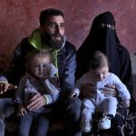 
              Ziad Khaled Hilweh, 23, who tried to migrate to Europe with his family, speaks during an interview as he sits with his wife Alaa Khodr, 22, his daughter Jana 2 year-old and his son Karim 3 months, at his parents house in the northern city of Tripoli, Lebanon, Monday, Dec. 6, 2021. Lebanese are setting off from the port city of Tripoli to attempt the perilous journey by boat to Cyprus and beyond in the hopes of reaching Europe. They are joining Iraqis, Afghans and Sudanese in leaving their homeland after Lebanon's economic collapse has thrown two-thirds of the population into poverty in just over a year. (AP Photo/Bilal Hussein)
            