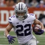 
              FILE - Kansas State running back Deuce Vaughn (22) runs against Texas during the first half of an NCAA college football game in Austin, Texas, Nov. 26, 2021. (AP Photo/Chuck Burton, file)
            