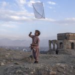 
              A boy flies a kite on Tape Nadir Khan hill in Kabul, Afghanistan, on Saturday, Dec. 4 , 2021. (AP Photo/Petros Giannakouris)
            