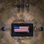From top left, Associate Justice Elena Kagan, Chief Justice of the United States John Roberts, and Justice Stephen Breyer, pay their respects as the casket of former Sen. Bob Dole lies in state in the Rotunda of the U.S. Capitol in Washington, Thursday, Dec. 9, 2021. (AP Photo/Andrew Harnik, Pool)