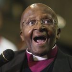 
              FILE - Anglican Archbishop Emeritus Desmond Tutu takes part in a Mass to celebrate four decades of episcopal ministry at a special thanksgiving Mass at St Mary's Cathedral in Johannesburg, July 20, 2016. Tutu, South Africa’s Nobel Peace Prize-winning activist for racial justice and LGBT rights and retired Anglican Archbishop of Cape Town, has died at the age of 90, South African President Cyril Ramaphosa has announced.  (AP Photo/Denis Farrell, File)
            