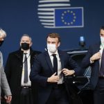 
              French President Emmanuel Macron arrives for an EU Summit at the European Council building in Brussels, Thursday, Dec. 16, 2021. European Union leaders meet for a one-day summit Thursday that will center on Russia's military threat to neighbouring Ukraine and on ways to deal with the continuing COVID-19 crisis. (Johanna Geron, Pool Photo via AP)
            