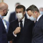 
              French President Emmanuel Macron, center, speaks with European Council President Charles Michel, left, and Luxembourg's Prime Minister Xavier Bettel, right, during a round table meeting at an EU Summit in Brussels, Thursday, Dec. 16, 2021. European Union leaders meet for a one-day summit Thursday that will center on Russia's military threat to neighbouring Ukraine and on ways to deal with the continuing COVID-19 crisis. (Olivier Hoslet, Pool Photo via AP)
            