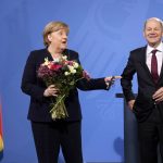 
              New elected German Chancellor Olaf Scholz, right, has given flowers to former Chancellor Angela Merkel during a handover ceremony in the chancellery in Berlin, Wednesday, Dec. 8, 2021. (Photo/Markus Schreiber)
            