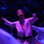 
              Whirling dervishes of the Mevlevi order perform during a Sheb-i Arus ceremony in Konya, central Turkey on Friday, Dec. 17, 2021. Every December the Anatolian city hosts a series of events to commemorate the death of 13th century Islamic scholar, poet and Sufi mystic Jalaladdin Rumi. (AP Photo/Francisco Seco)
            