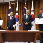 
              South Korean President Moon Jae-in, second left, and Australian Prime Minister Scott Morrison, second right, pose for photographs with South Korean Trade Minister Yeo Han-koo, left, and Australian Energy Minister Angus Taylor during a signing ceremony signing ceremony at Parliament House, in Canberra, Australia, Monday, Dec. 13, 2021. Moon is on a two-day official visit to Australia. (Lukas Coch/Pool Photo via AP)
            