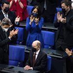 
              Olaf Scholz of the Social Democrats receives applause from lawmakers after he was elected new German Chancellor in the German Parliament Bundestag in Berlin, Wednesday, Dec. 8, 2021. The election and swearing-in of the new Chancellor and the swearing-in of the federal ministers of the new federal government will take place in the Bundestag on Wednesday. (Photo/Stefanie Loos)
            