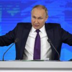 
              Russian President Vladimir Putin gestures while speaking during his annual news conference in Moscow, Russia, Thursday, Dec. 23, 2021. (AP Photo/Alexander Zemlianichenko)
            