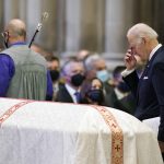 
              President Joe Biden returns to his seat after speaking at the funeral service of former Sen. Bob Dole of Kansas, at the Washington National Cathedral, Friday, Dec. 10, 2021, in Washington. (AP Photo/Jacquelyn Martin)
            