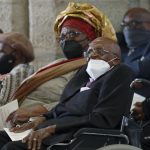 
              FILE - Anglican Archbishop Emeritus, Desmond Tutu, right, with his wife Leah, left, attends a church service in St. George's Cathedral in Cape Town, South Africa, Thursday, Oct. 7, 2021, as Tutu celebrates his 90th birthday. Tutu, South Africa’s Nobel Peace Prize-winning activist for racial justice and LGBT rights and retired Anglican Archbishop of Cape Town, has died, South African President Cyril Ramaphosa announced Sunday Dec. 26, 2021. He was 90. (AP Photo/Nardus Engelbrecht, File)
            