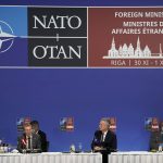 
              NATO Secretary General Jens Stoltenberg, second right, Minister of Foreign Affairs of Latvia Edgars Rinkevics, second left, NATO Chair of the Military Committee Admiral Rob Bauer, right, and NATO Deputy Secretary General Mircea Geoana attend the NATO Foreign Ministers meeting in Riga, Latvia, Tuesday, Nov. 30, 2021. (AP Photo/Roman Koksarov, Pool)
            