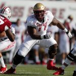 
              FILE - Boston College offensive lineman Zion Johnson (77) plays against Massachusetts during the first half of an NCAA college football game, Sept. 11, 2021, in Amherst, Mass. (AP Photo/Michael Dwyer, file)
            