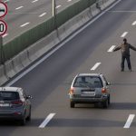 
              A protester stands on the highway during protest in Belgrade, Serbia, Saturday, Dec. 4, 2021. Protesters blocked roads and bridges across Serbia to protest against new the amendments to the Law on Referendum and Expropriation. (AP Photo/Darko Vojinovic)
            