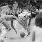 
              FILE - Spectators in foreground watch Buffalo Braves Marvin Barnes, left, battle for the loose ball with Golden State Warrior E.C. Coleman during the first quarter of action in the Oakland Coliseum Arena, March 21, 1978. (AP Photo/Paul Sakuma, File)
            
