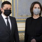 
              In this photo provided by Ukrainian Presidential Press Office, Ukrainian President Volodymyr Zelenskyy, left, and German Foreign Minister Annalena Baerbock pose for a photo during their meeting in Kyiv, Ukraine, Monday, Jan. 17, 2022. (Ukrainian Presidential Press Office via AP)
            