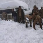 
              In this photo provided by the Inter Services Public Relations, army troops take part in a rescue operation in a heavy snowfall-hit area in Murree, some 28 miles (45 kilometers) north of the capital of Islamabad, Pakistan, Saturday, Jan. 8, 2022. Temperatures fell to minus 8 degrees Celsius (17.6 Fahrenheit) amid heavy snowfall at Pakistan's mountain resort town of Murree overnight, killing multiple people who were stuck in their vehicles, officials said Saturday. (Inter Services Public Relations via AP)
            