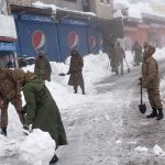 
              In this photo provided by the Inter Services Public Relations, army members take part in a rescue operation in a heavy snowfall-hit area in Murree, some 28 miles (45 kilometers) north of the capital of Islamabad, Pakistan, Saturday, Jan. 8, 2022. Temperatures fell to minus 8 degrees Celsius (17.6 Fahrenheit) amid heavy snowfall at Pakistan's mountain resort town of Murree overnight, killing multiple people who were stuck in their vehicles, officials said Saturday. (Inter Services Public Relations via AP)
            