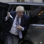 
              Britain's Prime Minister Boris Johnson arrives back at 10 Downing Street in London, Tuesday, Jan. 25, 2022. London police say they are investigating Downing Street lockdown parties in 2020 to determine if U.K. government officials violated coronavirus restrictions. Tuesday's announcement puts further pressure on British Prime Minister Boris Johnson.  (AP Photo/Alastair Grant)
            