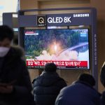 
              People watch a TV screen showing a news program reporting about North Korea's missile launch with a file footage, at a train station in Seoul, South Korea, Friday, Jan. 14, 2022. North Korea on Friday fired two short-range ballistic missiles in its third weapons launch this month, officials in South Korea said, in an apparent reprisal for fresh sanctions imposed by the Biden administration for its continuing test launches. (AP Photo/Lee Jin-man)
            