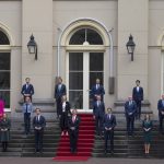 
              Dutch King Willem-Alexander, center, and Prime Minister Mark Rutte, center left, pose with other ministers of the new the government at Royal Palace Noordeinde in The Hague, Netherlands, Monday, Jan. 10, 2022, after been sworn in by the King as the new ruling coalition amid a nationwide coronavirus lockdown and policy challenges ranging from climate change to housing shortages to the future of agriculture. (AP Photo/Peter Dejong)
            