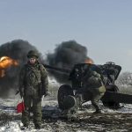 
              In this photo taken from video provided by the Russian Defense Ministry Press Service on Friday, Jan. 28, 2022, Russian troops fire howitzers during drills in the Rostov region during a military exercising at a training ground in Rostov region, Russia. (Russian Defense Ministry Press Service via AP)
            
