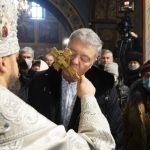 
              Former Ukrainian President Petro Poroshenko kisses the cross during service at the Mikhailovsky Zlatoverkhy Cathedral (St. Michael's Golden-Domed Cathedral) in Kyiv, Ukraine, Wednesday, Jan. 19, 2022. On this Wednesday a Kyiv court is due to rule on whether to remand former Ukrainian President Petro Poroshenko in custody pending investigation and trial on treason charges he believes are politically motivated. (AP Photo/Mikhail Palinchak)
            