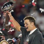 
              FILE - In this Feb. 7, 2021, file photo, Tampa Bay Buccaneers quarterback Tom Brady celebrates with the Vince Lombardi Trophy after the team's NFL Super Bowl 55 football game against the Kansas City Chiefs in Tampa, Fla. Despite reports that he is retiring, Brady has told the Tampa Bay Buccaneers he hasn't made up his mind, two people familiar with the details told The Associated Press, Saturday, Jan. 29, 2022. (AP Photo/Lynne Sladky, File)
            