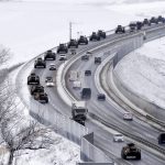 
              A convoy of Russian armored vehicles moves along a highway in Crimea, Tuesday, Jan. 18, 2022. Russia has concentrated an estimated 100,000 troops with tanks and other heavy weapons near Ukraine in what the West fears could be a prelude to an invasion. (AP Photo)
            