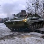 
              In this photo taken from video provided by the Russian Defense Ministry Press Service, A Russian armored vehicle drives off a railway platform after arrival in Belarus, Wednesday, Jan. 19, 2022. In a move that further beefs up forces near Ukraine, Russia has sent an unspecified number of troops from the country's far east to its ally Belarus, which shares a border with Ukraine, for major war games next month. (Russian Defense Ministry Press Service via AP)
            