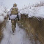 
              A Ukrainian serviceman walks through a trench on the front line in the Luhansk area, eastern Ukraine, Thursday, Jan. 27, 2022. The U.S. rejection of Russia's main demands to resolve the crisis over Ukraine left "little ground for optimism," the Kremlin said Thursday, but added that dialogue was still possible. (AP Photo/Vadim Ghirda)
            