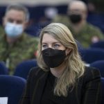 
              In this photo provided by Ukrainian National Guard Press Office Canada's Minister of Foreign Affairs Melanie Joly listens to a Canadian instructor's report during her visit to the National Guard base close to Kyiv, Ukraine, Tuesday, Jan. 18, 2022. (Ukrainian National Guard Press Office via AP)
            