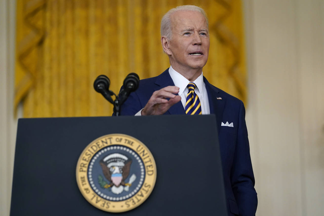 President Joe Biden speaks during a news conference in the East Room of the White House in Washingt...